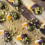 Chocolate covered mandarins with pistachios