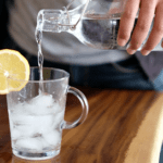 Water being poured into a cup of ice.