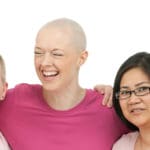 Still photo of five women smiling at the camera