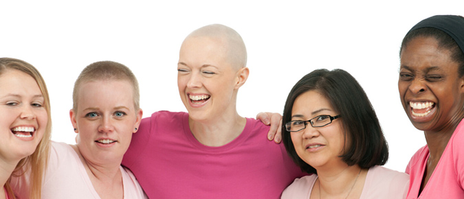 Still photo of five women smiling at the camera