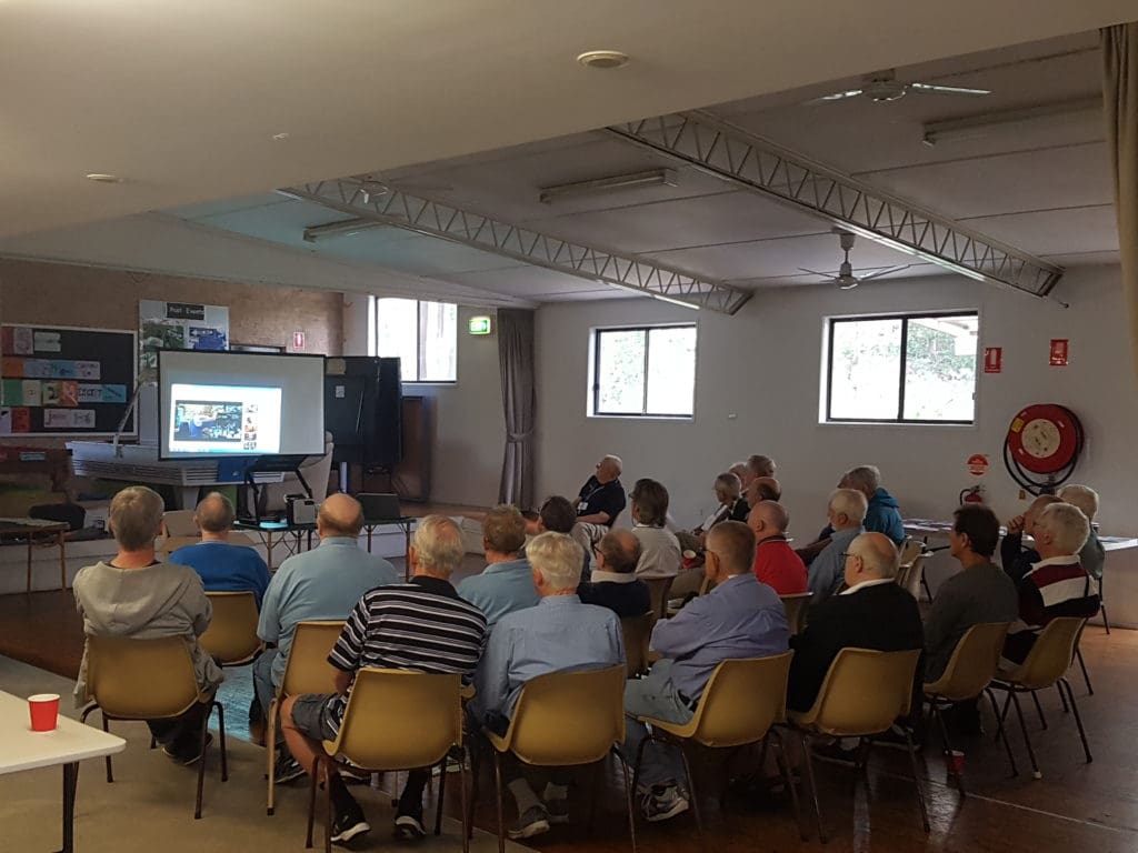 A group of men gathered together for a Prostate Cancer Support Group meeting 