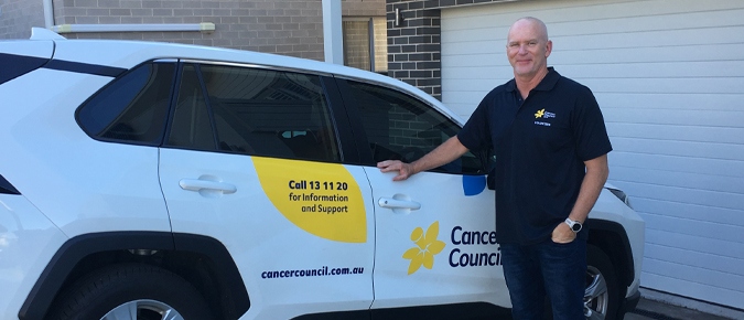 John Fox with a Cancer Council vehicle. 