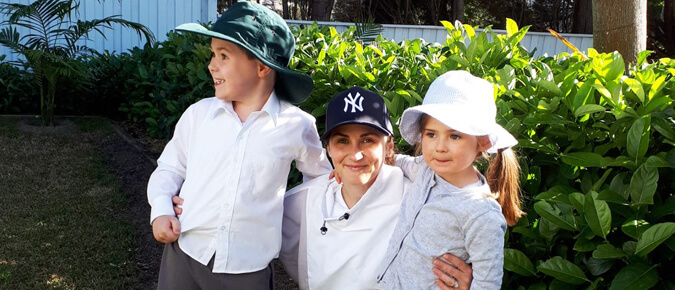 Melanoma survivor, Stacey with her two young children. 