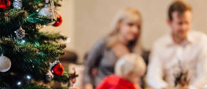 A family and a Christmas tree.