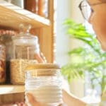 Woman looking at kitchen pantry