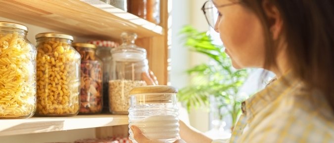 Woman looking at kitchen pantry