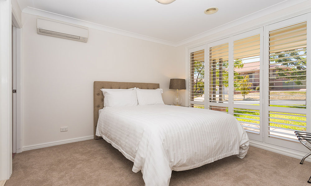 A double bed in a clean room