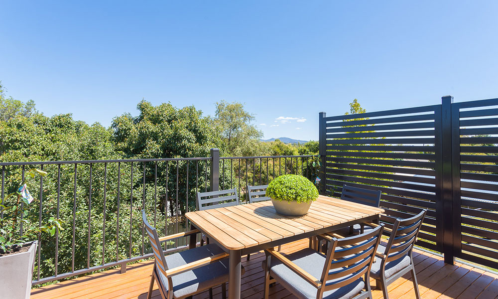 An outdoor dining setting with a nice view