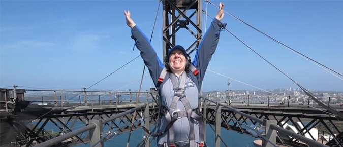 Bridget with her hands up in the air. 