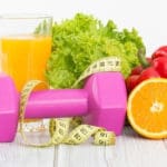 Healthy selection of fruits with a dumbbell