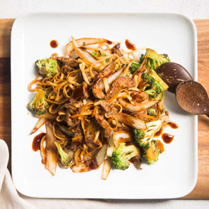A plate of beef and broccoli stir fry.