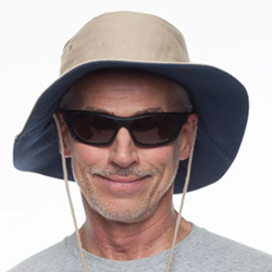 Man wearing sunglasses and hat.