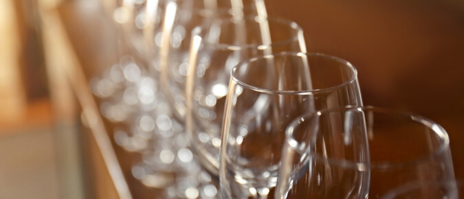 Row of empty wine glasses.