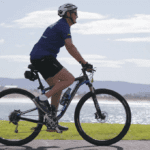 woman riding bicycle for cancer council ride500 campaign