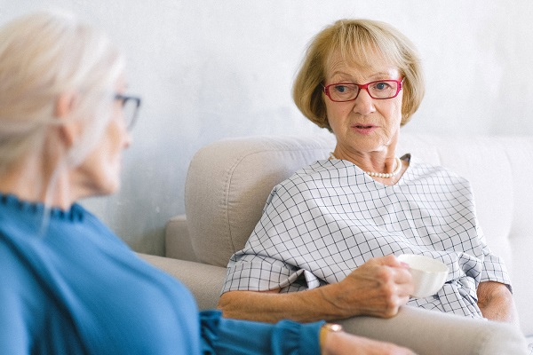 two elderly women chatting