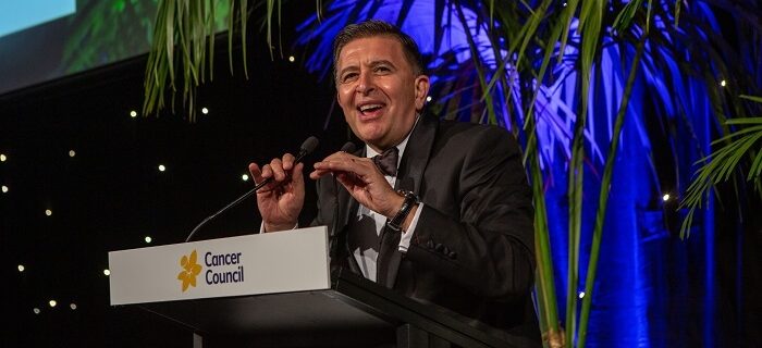 Vince Sorrenti speaking at podium at cancer council POSH gala