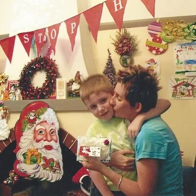 Kane receives a Christmas present and a kiss