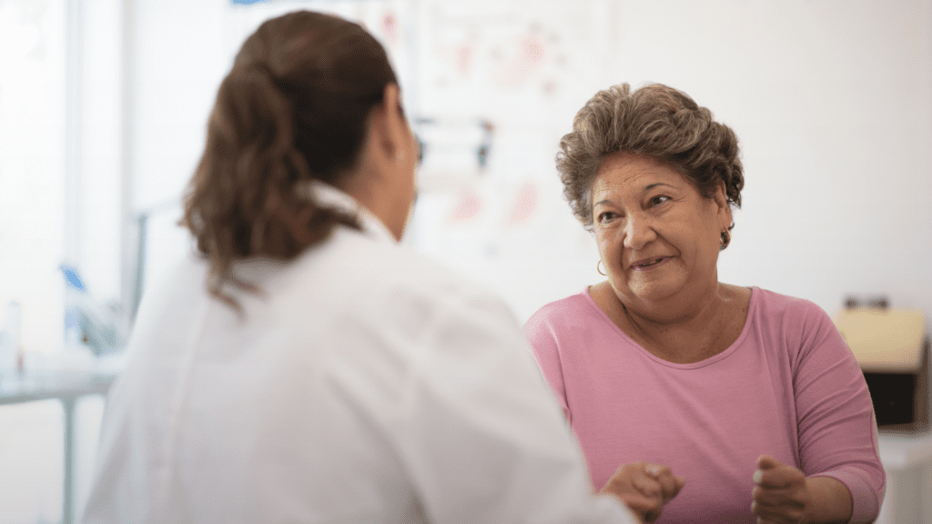 A woman talking to her GP about her cervical screening test.