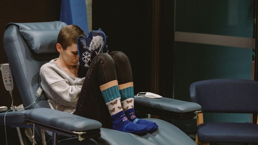 Rhiannon wearing cold gloves during her chemotherap.