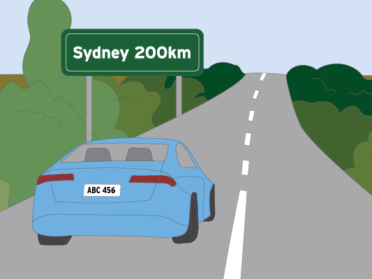 Image of a car driving down road.