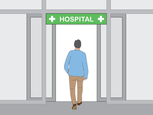 Image of a man walking into a hospital.