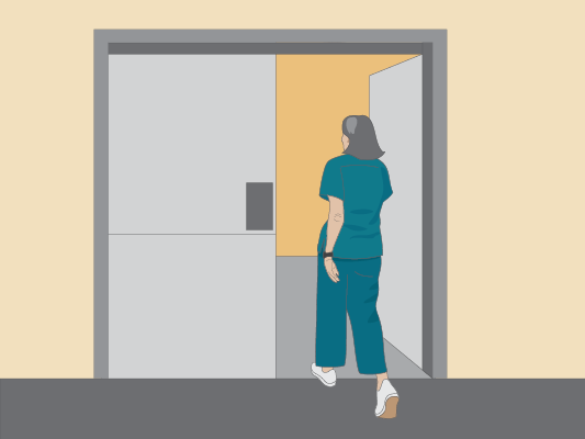 Image of the radiation therapist leaving the room before they start the machine.