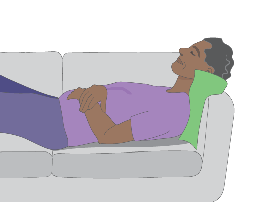 Image of man lying on a couch.