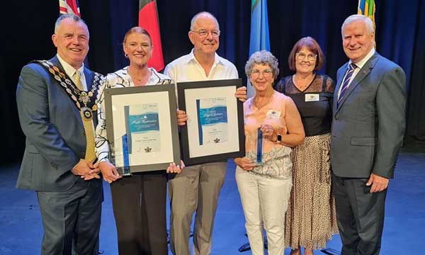 Volunteers being honoured by dignitaries