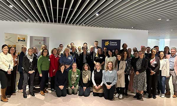 A photo of a large group of participants in the round table