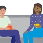 Cartoon illustration of two ladies chatting and drinking coffee on couch