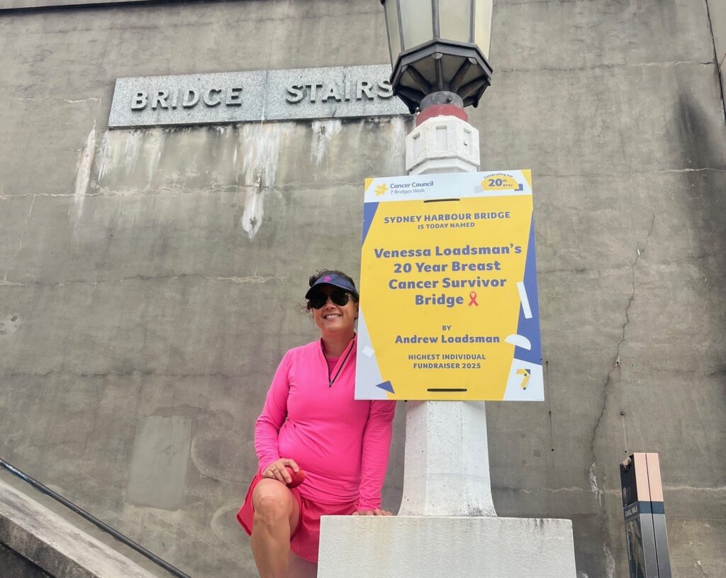 Venessa Loadsman beside the Seven Bridges Walk bridge dedicated to her, recognising the milestone that helped inspire more than a decade of fundraising for Cancer Council NSW.